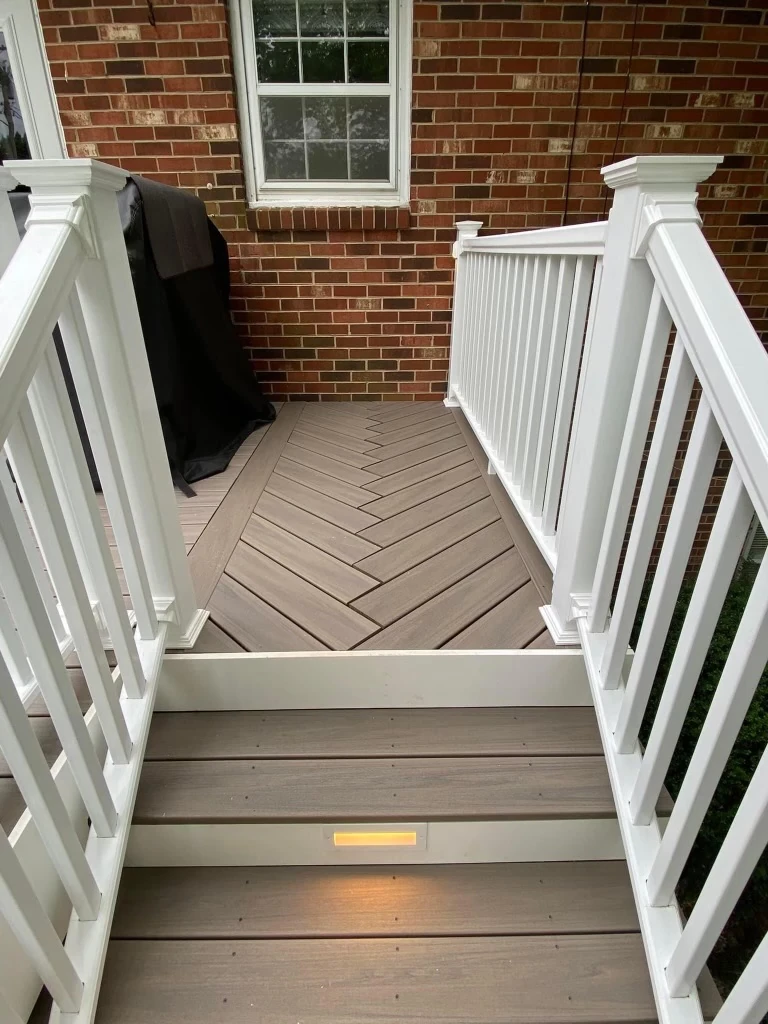 close-up-view-of-the-residential-deck-with-deck-lighting-and-white-railing
