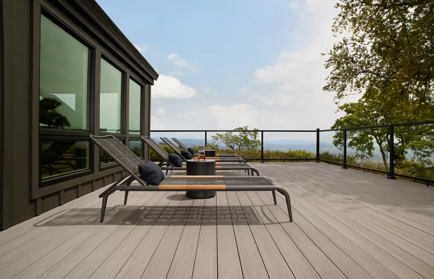 commercial-decking-with-glass-railing-and-outdoor-living-furniture