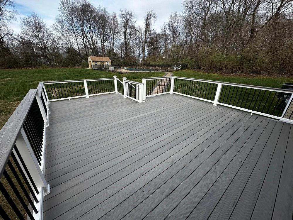 long-composite-decking-with-black-railing-featuring-nature-scenery