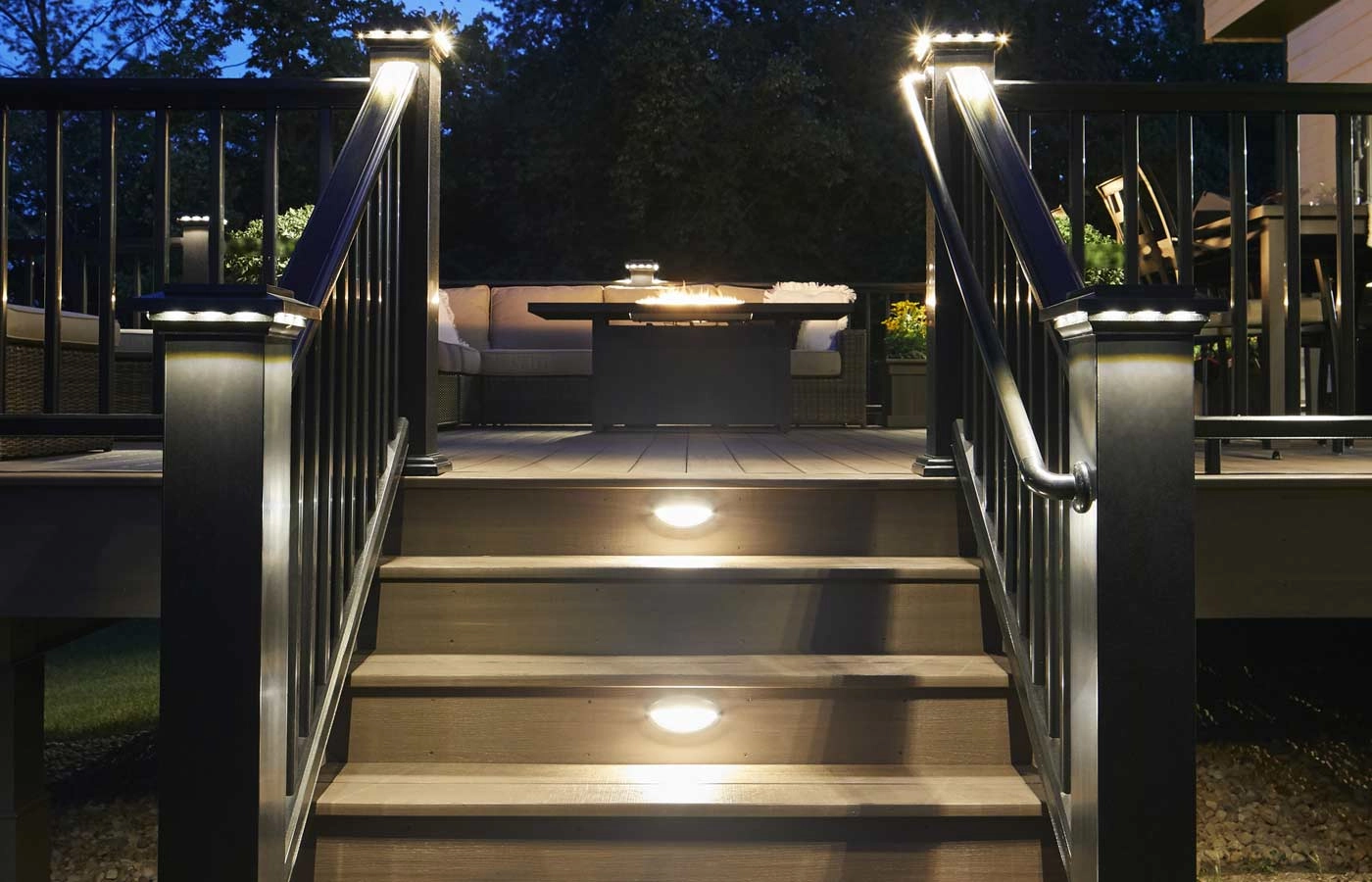 night-view-of-residential-decking-with-lighting-and-outdoor-living-furniture-and-firepit