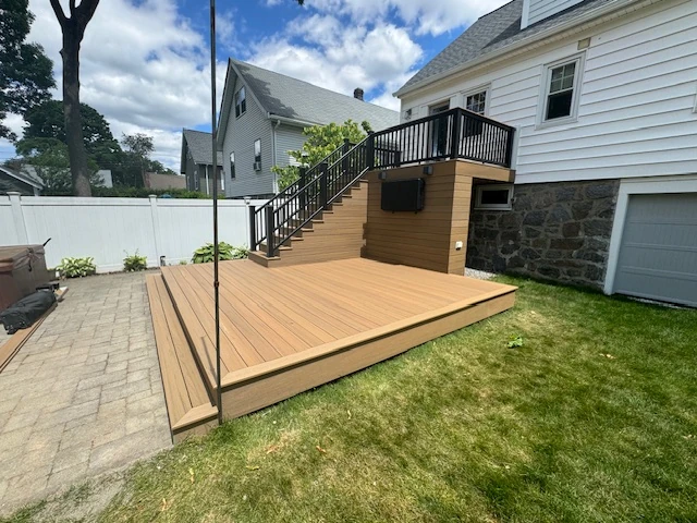 pressure-treated-wood-with-elevated-deck-and-black-railing