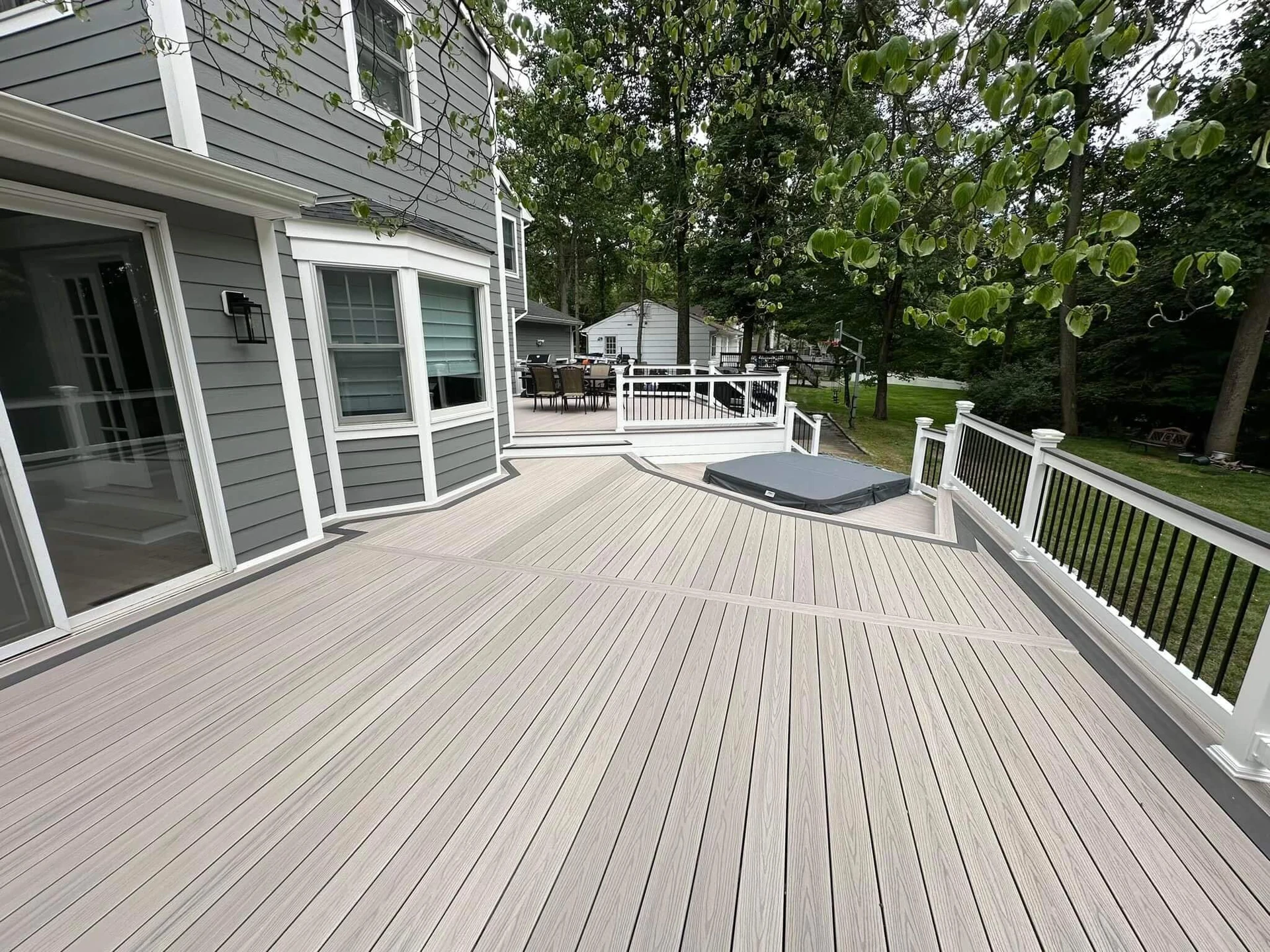 residential-deck-maintenance-with-screen-porch-and-aluminum-railing