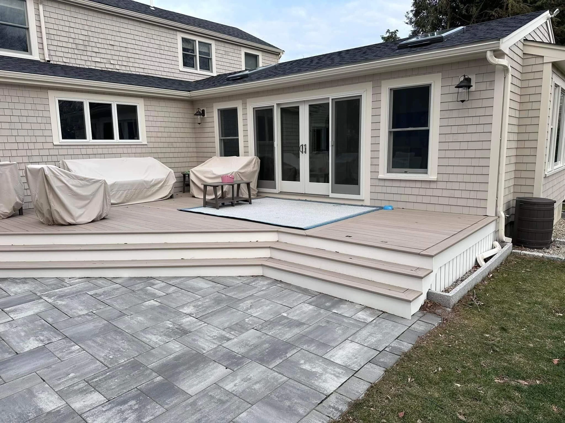 residential-deck-with-covered-furniture-and-glass-door