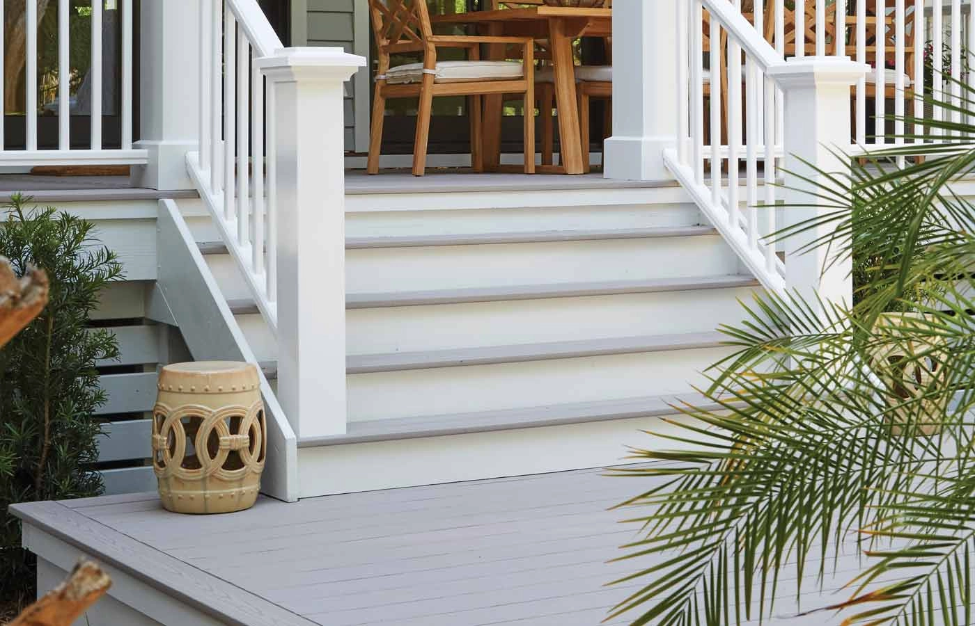 slate-gray-decking-with-white-railing-and-outdoor-furniture
